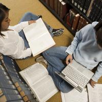 Two female students studying in the library