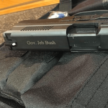 Tweet by Jeb Bush, picture of a handgun with the caption "America"